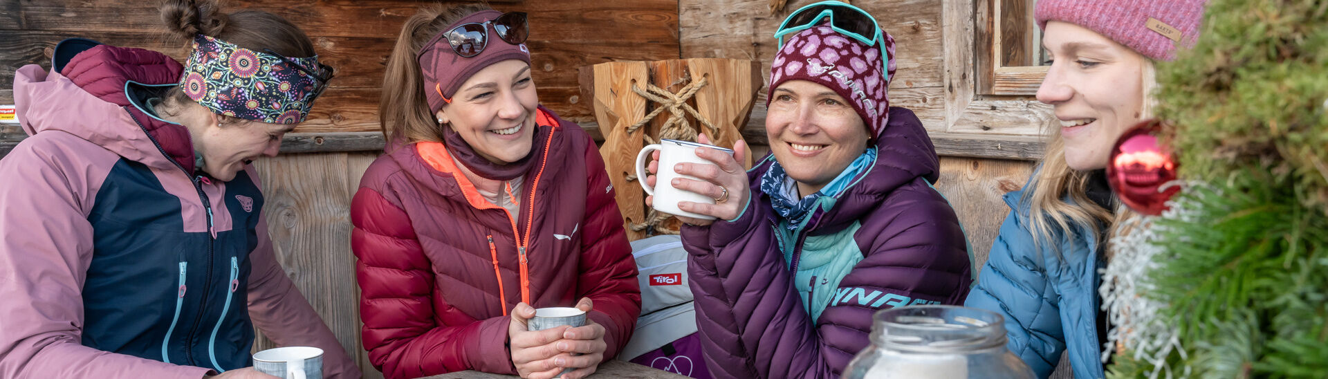 Refreshments in the Karwendel valleys A group of friends enjoy tea and a snack on the terrace of a mountain hut.