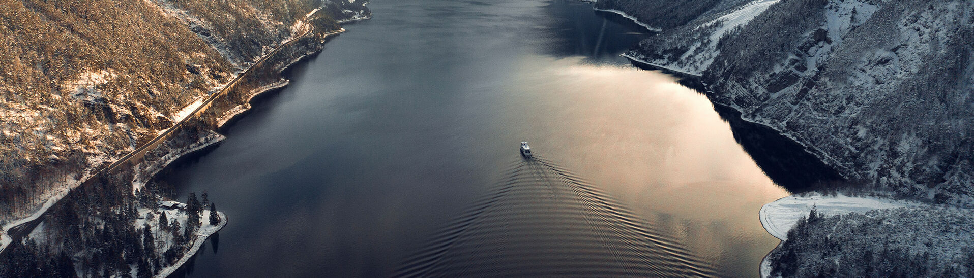 View of Lake Achensee View of Lake Achensee and one of the Achensee ships in winter, the village of Pertisau and the snow-covered Karwendel mountains.
