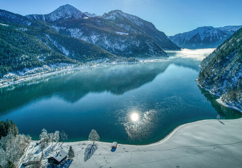 Natural health practitioner Achenkirch am Achensee affords breathtaking views of the wintry scenery.