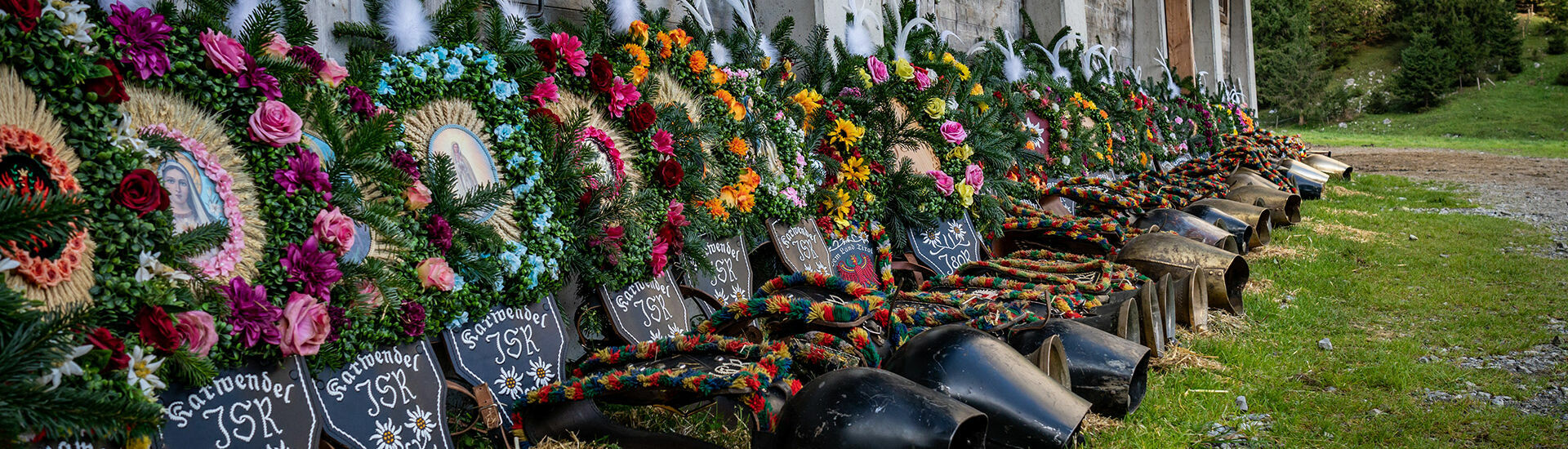 Headdresses for the cattle drive of the Graimai Alm Over several days, farmers and herders make elaborate headdresses using flowers, ribbons, banners, and pictures of saints.