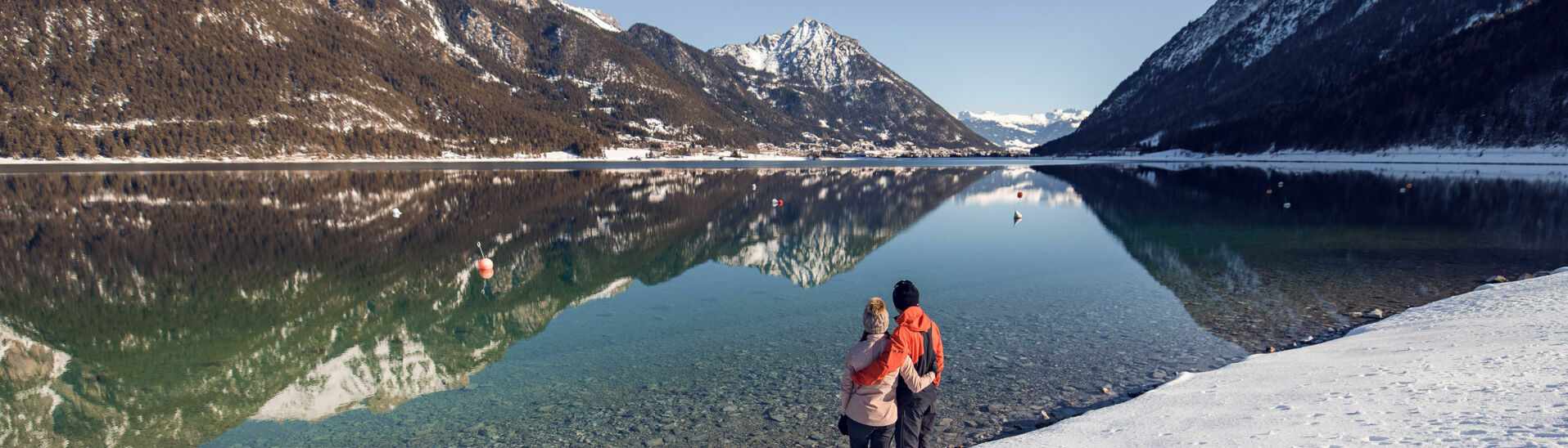 Winter hiking at Lake Achensee The Achensee region boasts over 150 kilometres of cleared winter walks, offering hiking opportunities in stunning winter scenery and beautiful views of Lake Achensee.