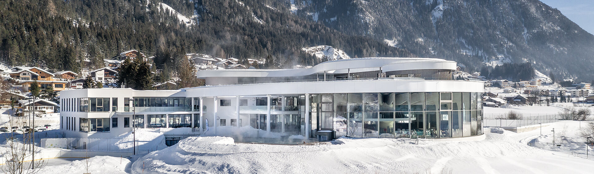 Aerial shot of the leisure centre Atoll Achensee in Maurach in winter.