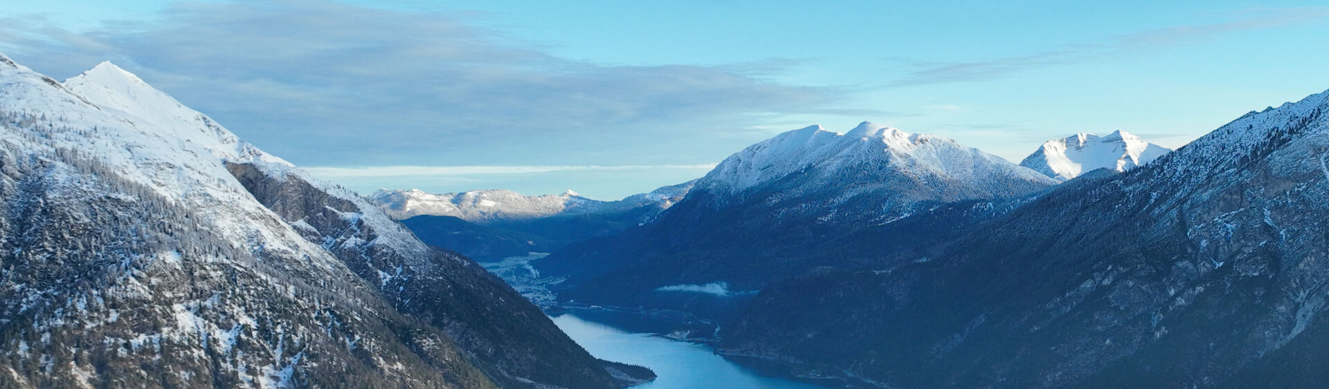 The landscape at Lake Achensee, when it is already spring-like in the valley and the peaks are covered in snow.