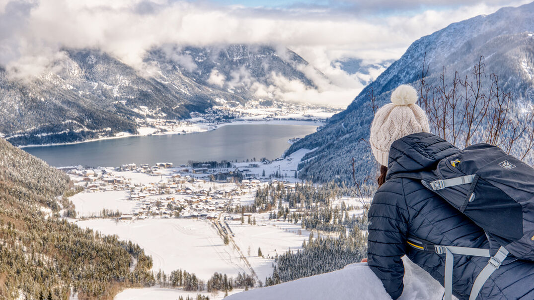 View of the snow-covered Achensee region Beautiful view over the snow-covered village of Pertisau, Lake Achensee and the village of Maurach.