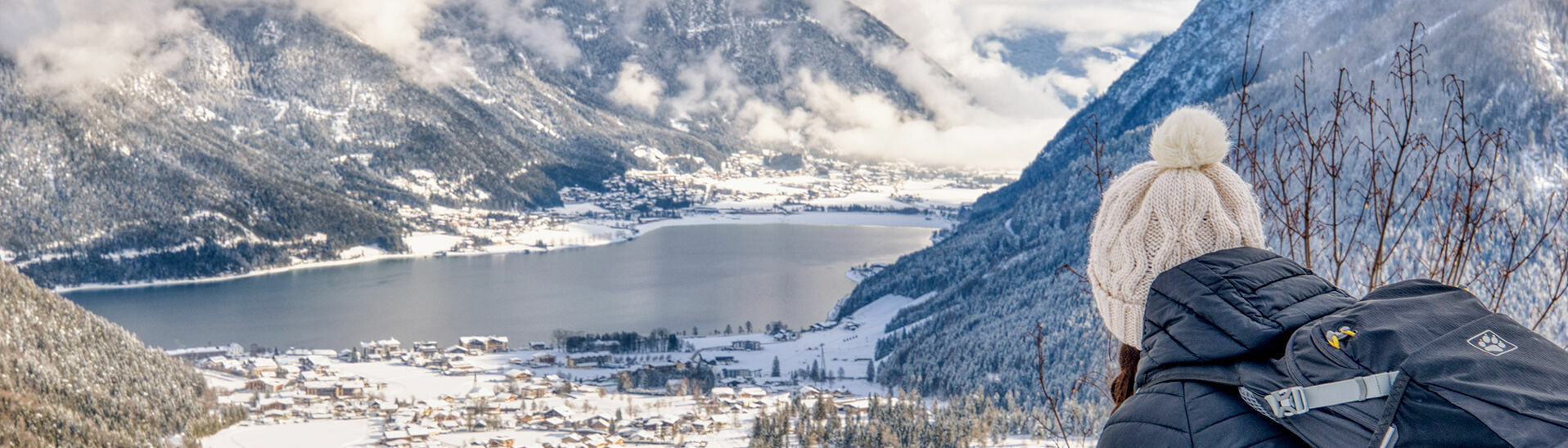 View of the snow-covered Achensee region Beautiful view over the snow-covered village of Pertisau, Lake Achensee and the village of Maurach.