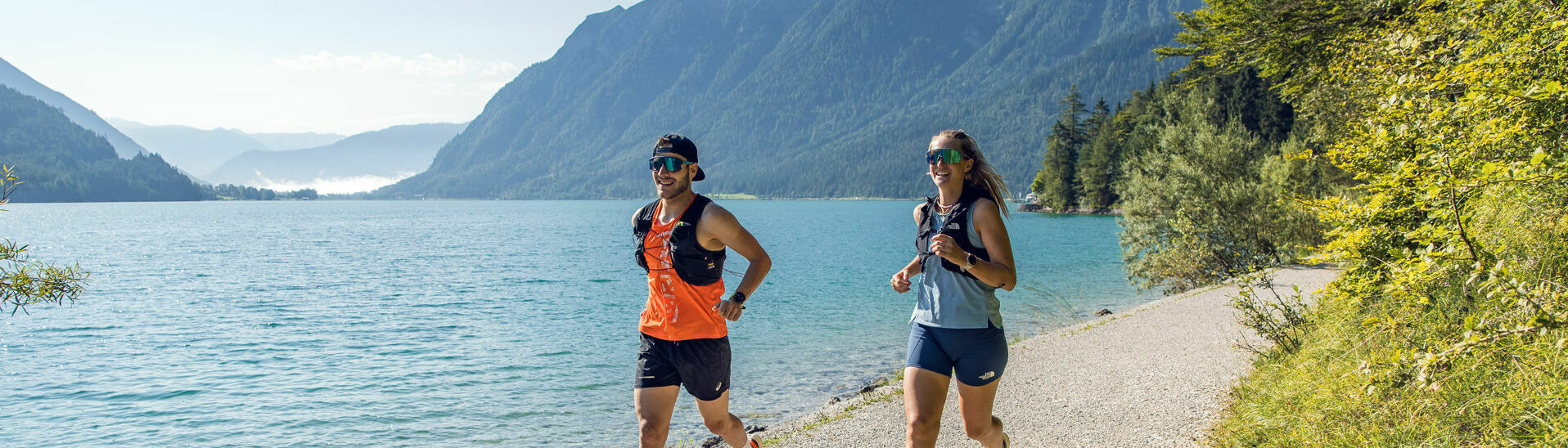 Running at Lake Achensee Two runners in beautiful summer weather on the shore of Lake Achensee.