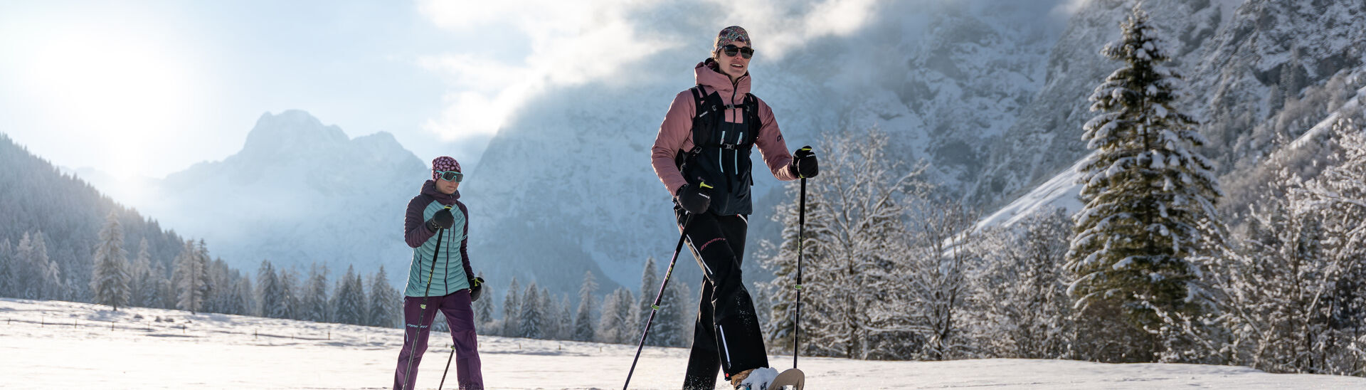 Snowshoeing with friends in the Falzthurntal valley Two friends go on a snowshoe hike in glorious weather in the Falzthurntal valley in the Karwendel Nature Park.