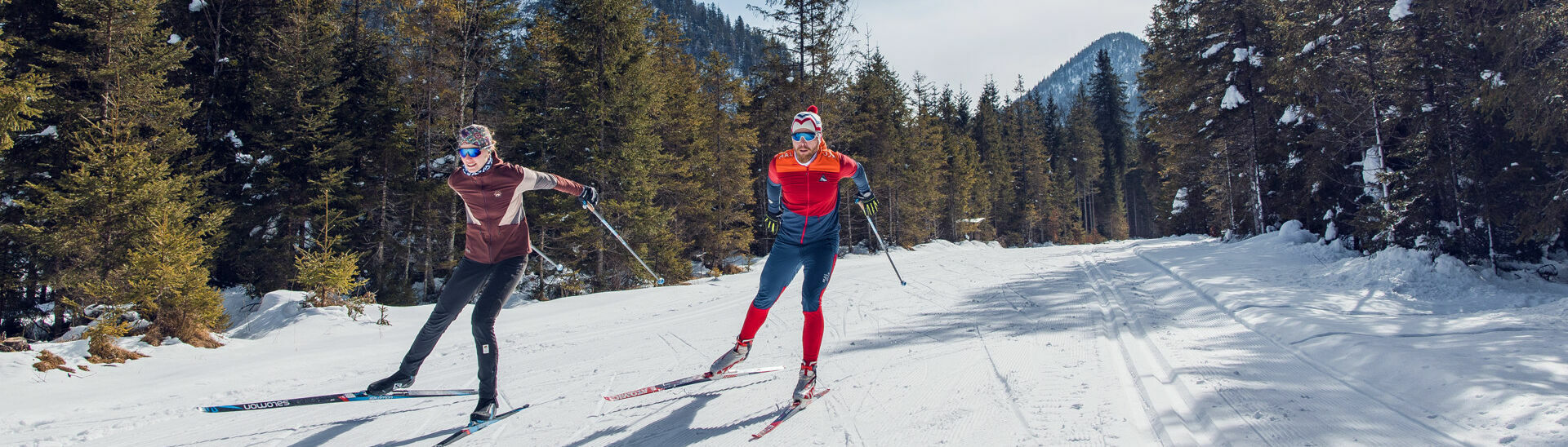 Cross-country skiing in Steinberg am Rofan A couple enjoys cross-country skiing in Steinberg am Rofan surrounded by snowy landscapes.