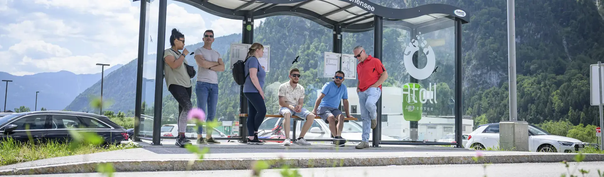 Bus stop at the Atoll Achensee A group of people waiting for the next bus at the bus stop of the Atoll Achensee.
