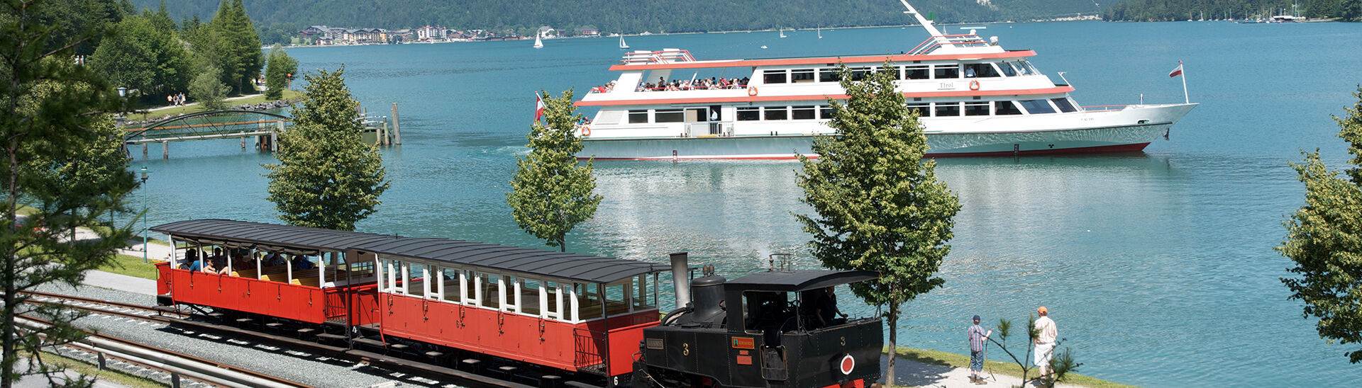 Bahn und Schiff am Achensee Mit dem Zeitalter der Achensee Dampf-Zahnradbahn und der Achenseeschifffahrt begann der Tourismus am Achensee.