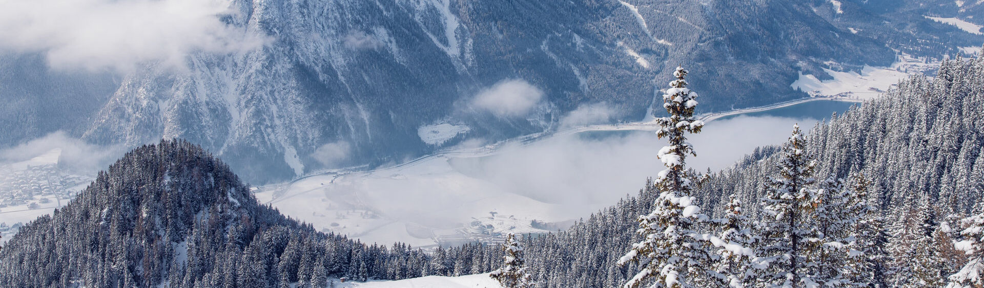 View from the Rofan mountains over the snow-covered Achensee region and the Nature Park Karwendel.