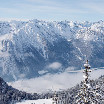 The Achensee region in winter View from the Rofan mountains over the snow-covered Achensee region and the Nature Park Karwendel.