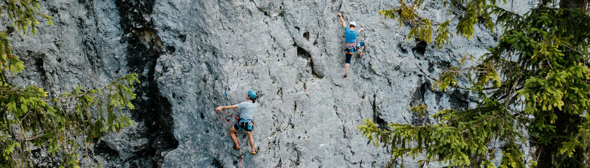 Climbing at Lake Achensee Two climbers enjoying the rugged rock face on Lake Achensee and practising lead climbing.