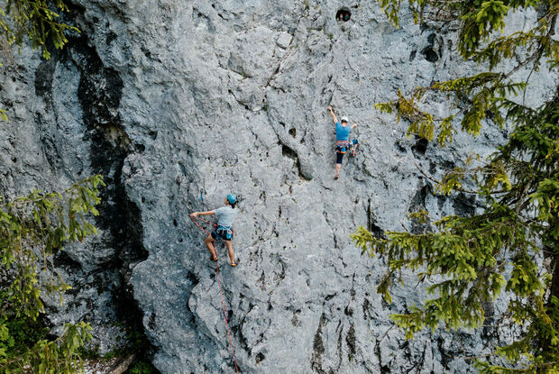 Climbing at Lake Achensee Two climbers enjoying the rugged rock face on Lake Achensee and practising lead climbing.