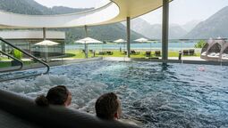 outdoor pool of the Penthouse-SPA with a view of Lake Achensee